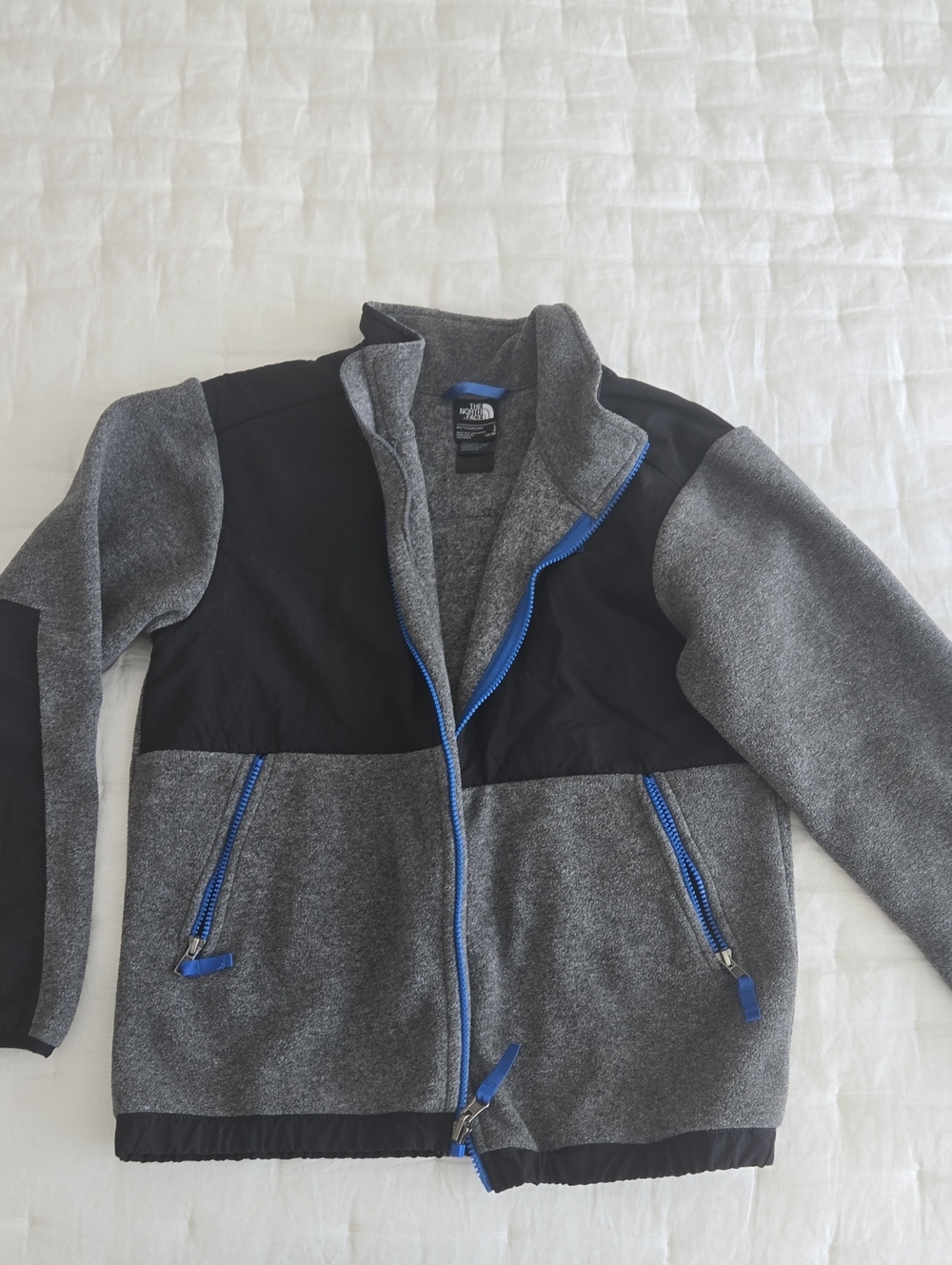 The North Face Boy’s Grey & Black Fleece Winter Jacket with Blue Zippers